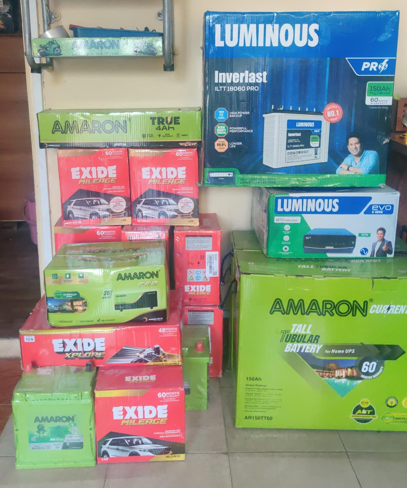 Indian shop owner checking wholesale battery stock